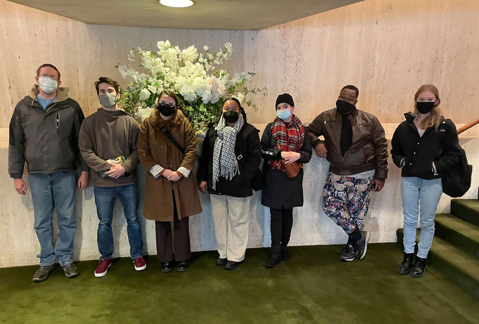 A group of UNO students poses in the lobby while going to a play in Chicago