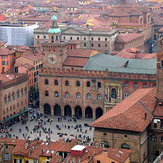 Aerial view of a city square surrounded by brick and terra cotta buildings.