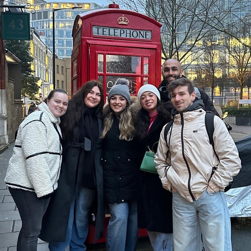 Group photo in front of red phone booth
