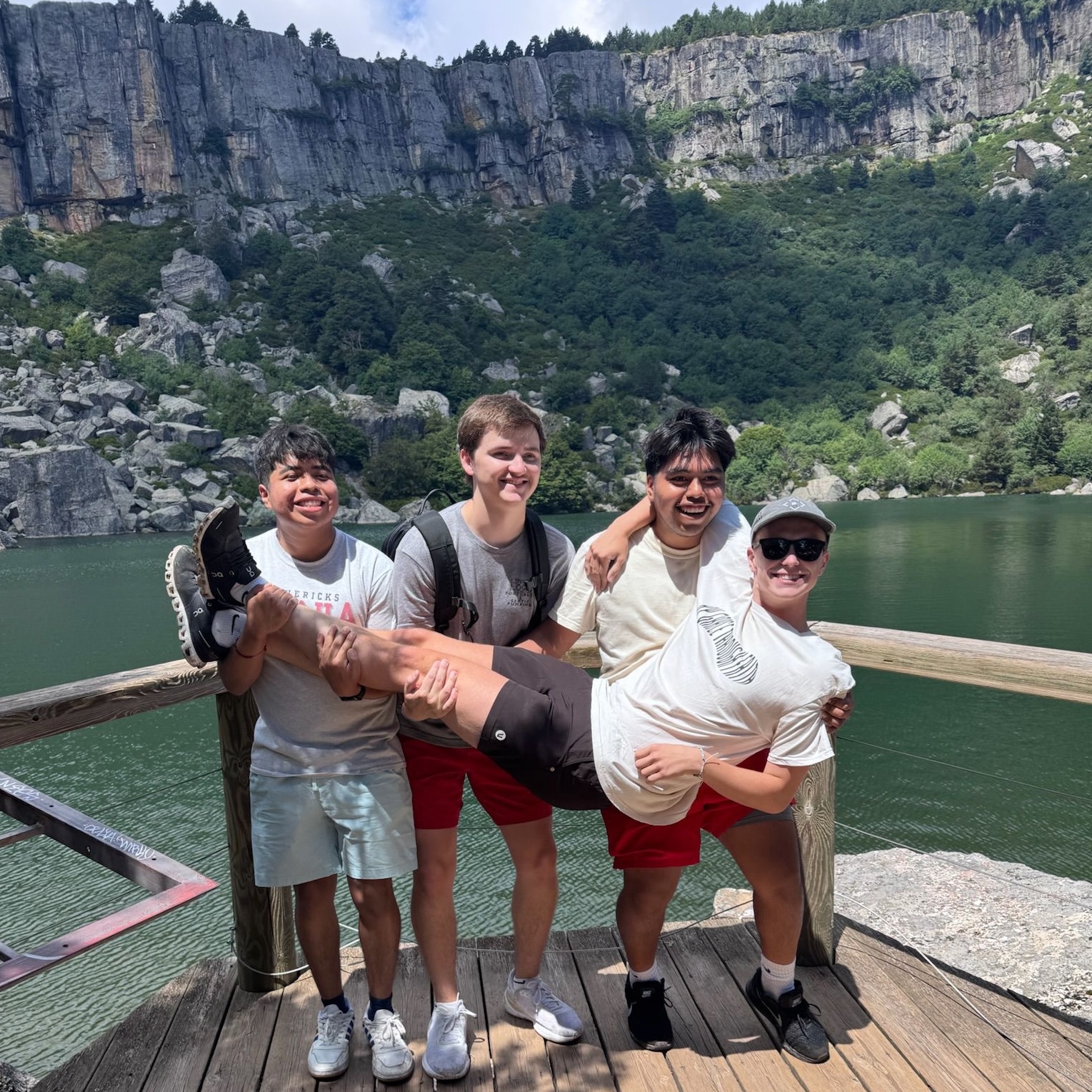 Group photo of students in front of a lake