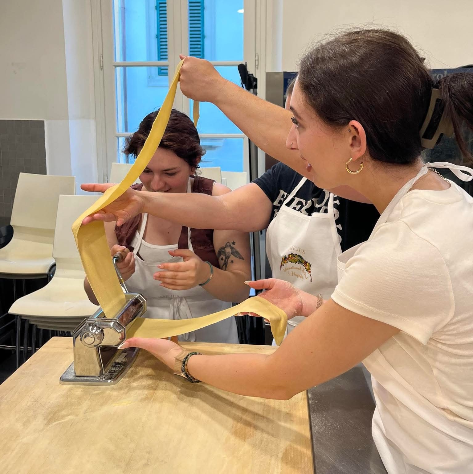 Students making ravioli by hand in Italy