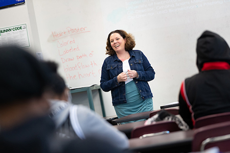 teacher speaking to students in class