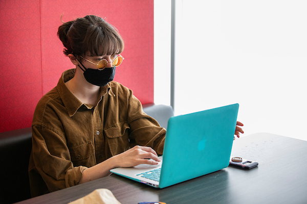 student studying while wearing mask 