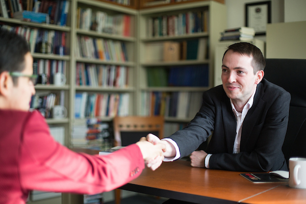 two people shaking hands