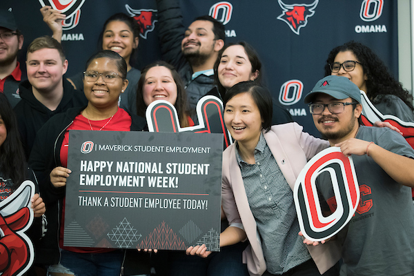 students holding a national student employment week sign