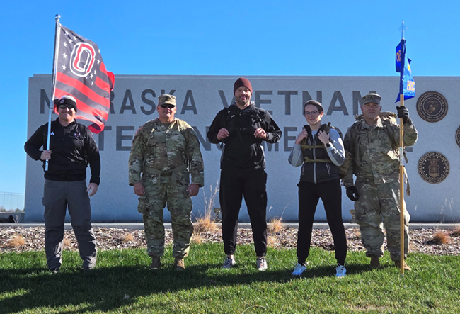 UNO Staff and National Guard members complete 10 mile ruck at the Nebraska Vietnam War Memorial.