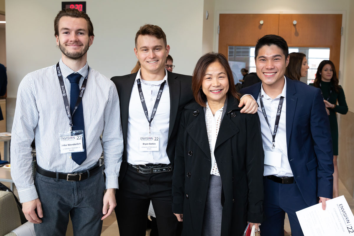 UNO Chancellor Joanne Li poses with NCITE students at ENVISION22. 