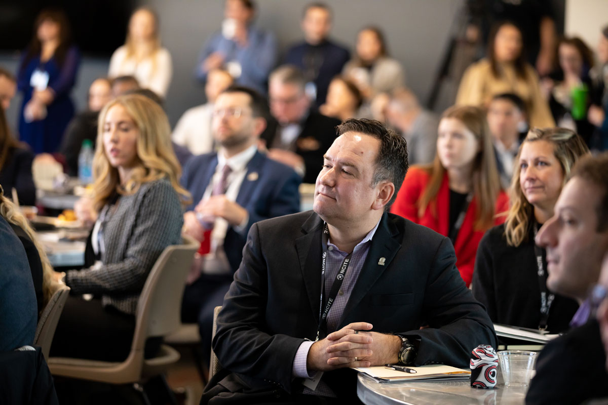 NCITE's Matt Allen watches the stage at ENVISION22. 