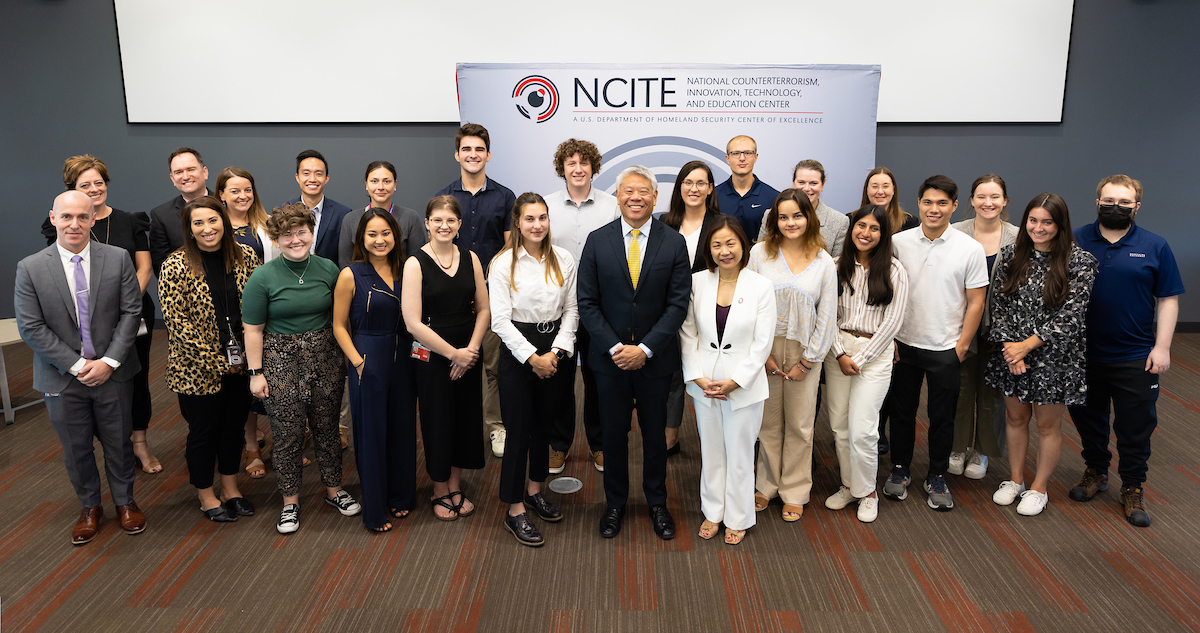 DHS Deputy Secretary John Tien poses with NCITE students, staff, and faculty during his visit.