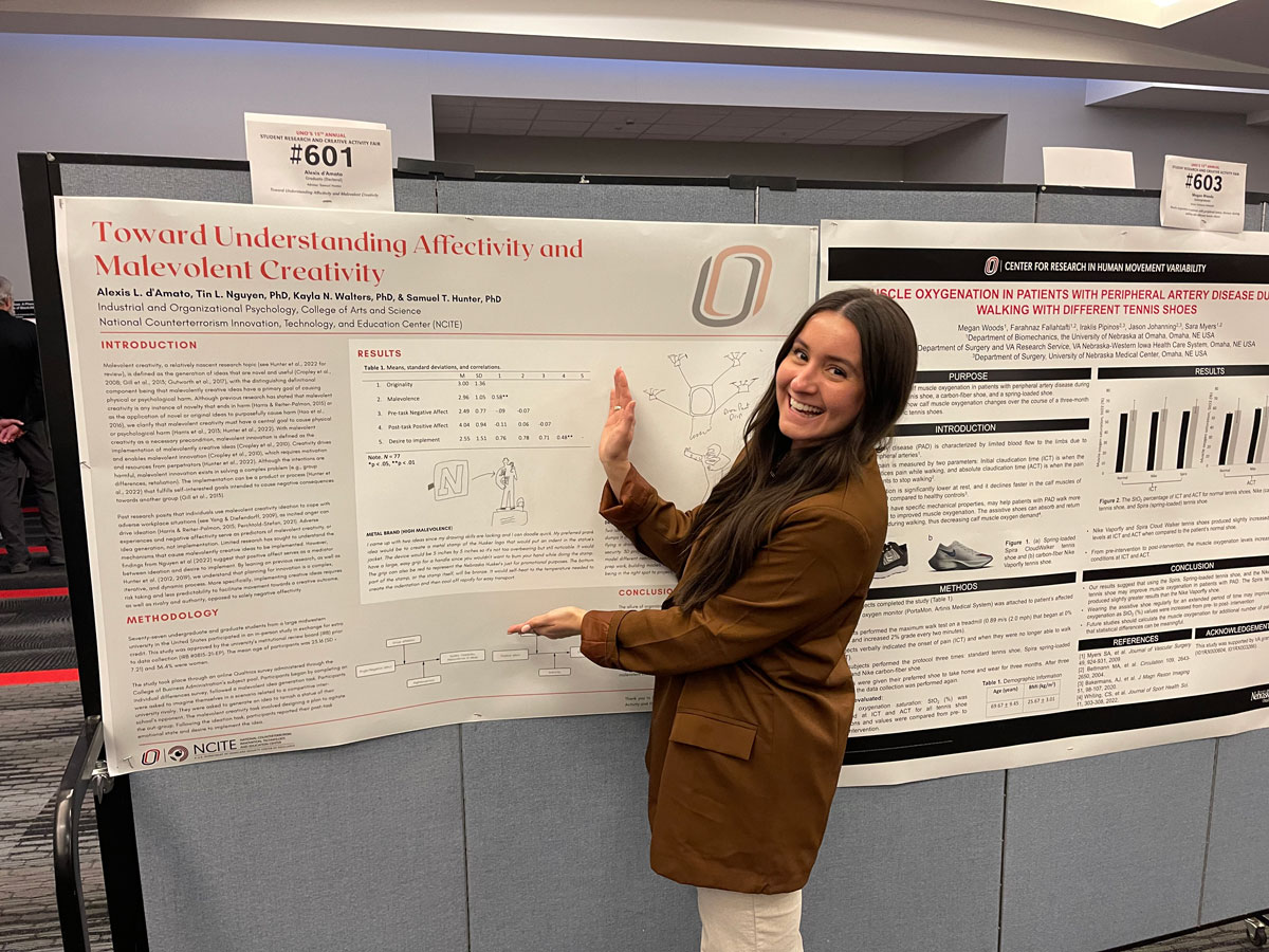 NCITE student Alexis d'Amato presents her research poster. 