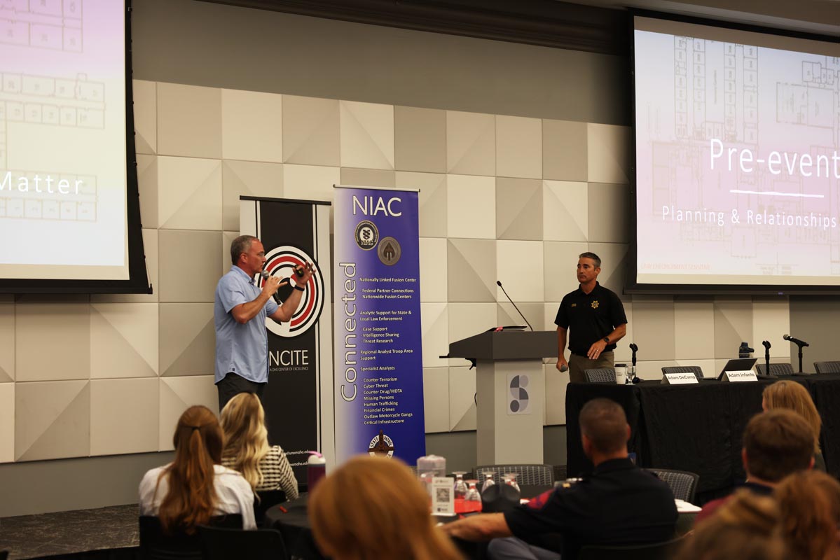 A speaker presents to attendees during a conference session at the advisory board summit.