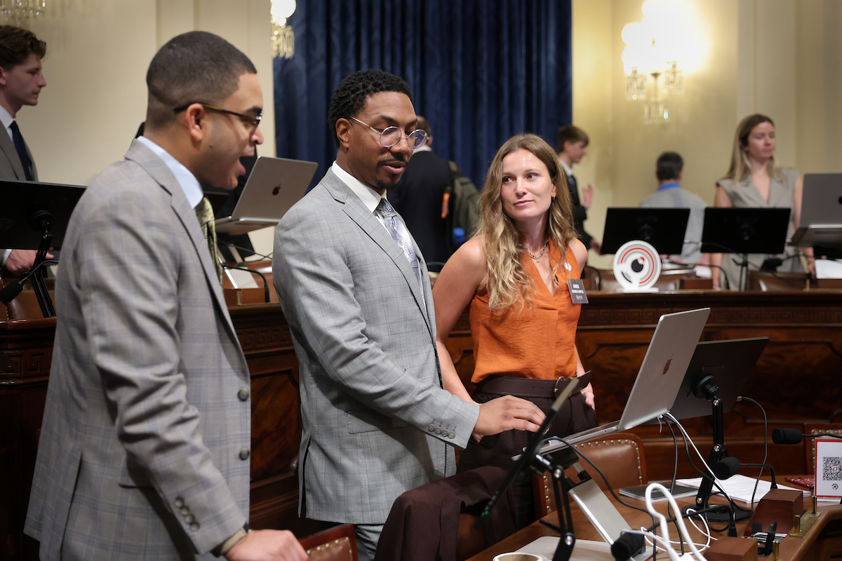 NCITE researcher speaks with congressional staff during an AI demonstration on Capitol Hill.