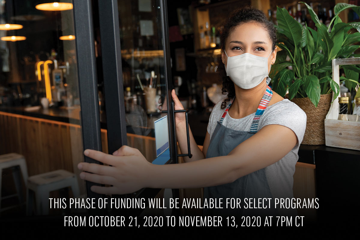 Female with face mask opening store.