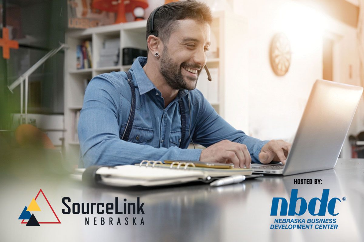 Smiling, white male with headset staring at laptop; SourceLink Nebraska Logo and NBDC Logo