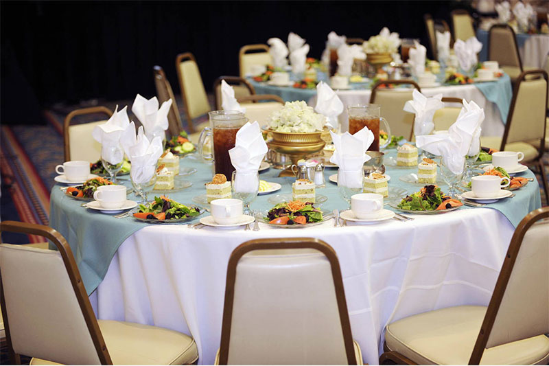 Banquet table with salads for eight