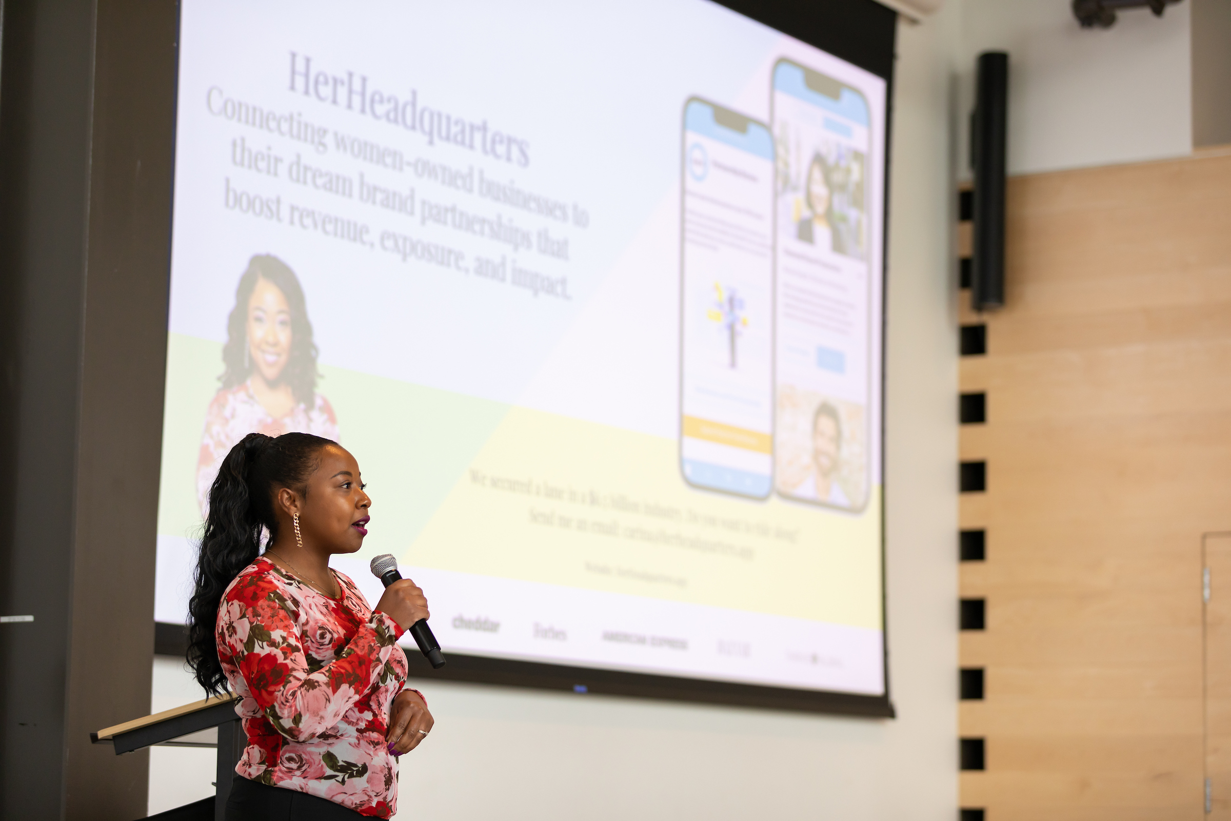 Carina Glover, owner of HerHeadquarters, presents her pitch
