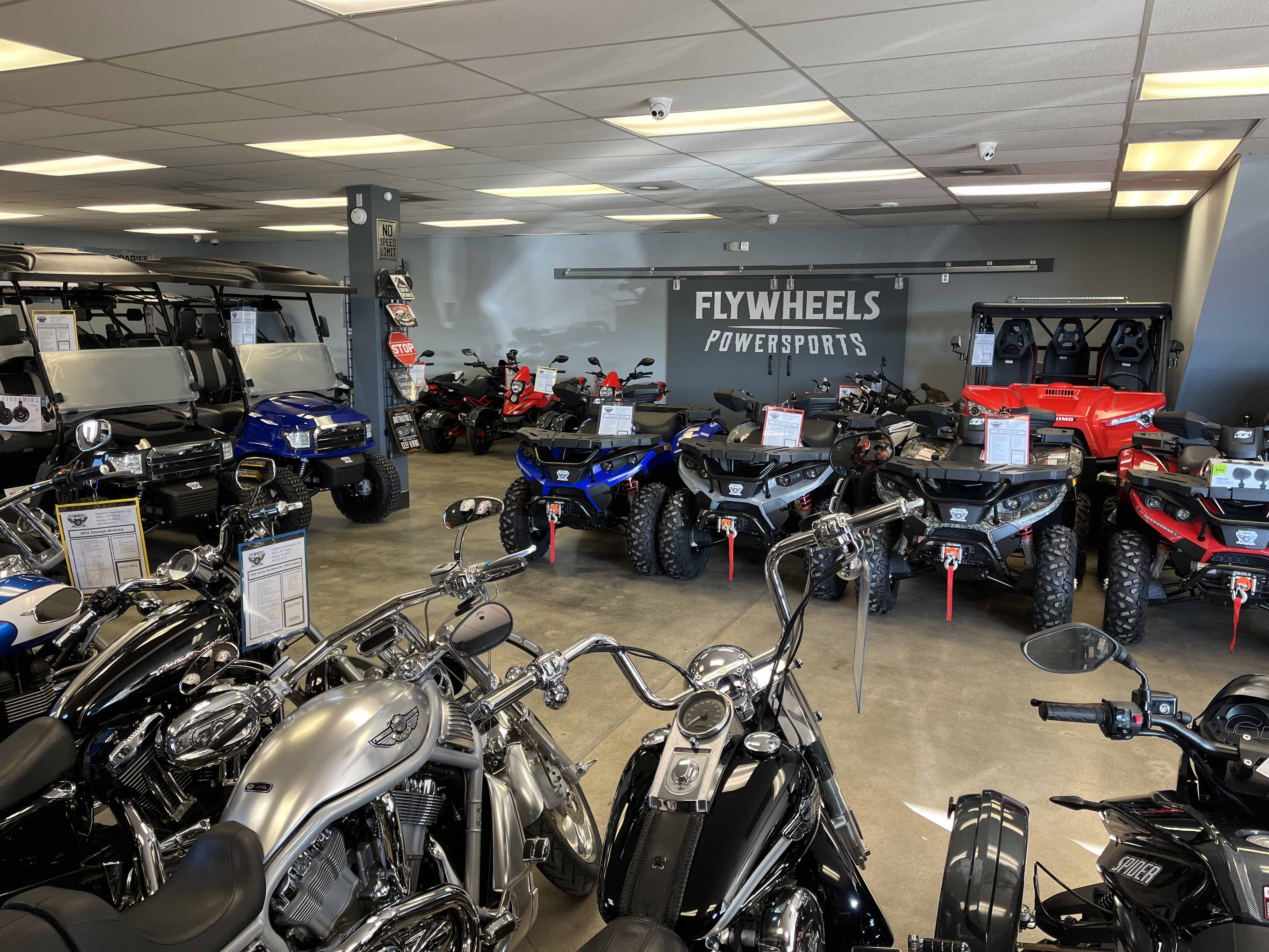 Showroom that includes ATVs, Utility task vehicles, and motorcycles