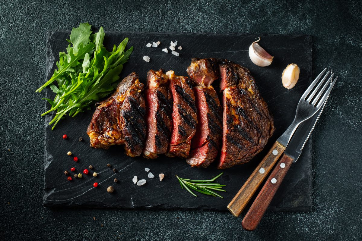 Photo of a steak on a slate cutting board 