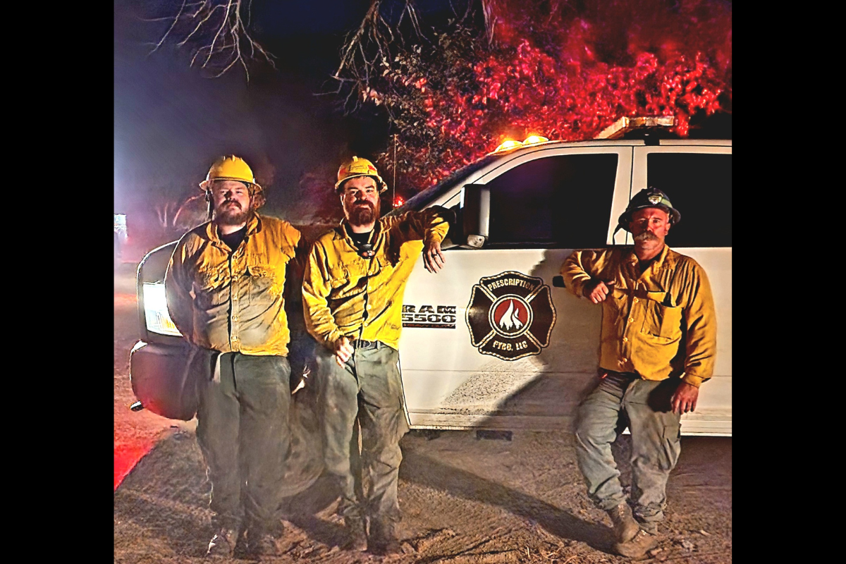 Prescription Pyro team in front of their truck at a job site