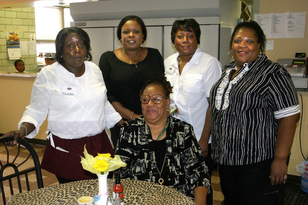 Patricia “Big Mama” Barron with Daughters at the Restaurant Grand Opening
