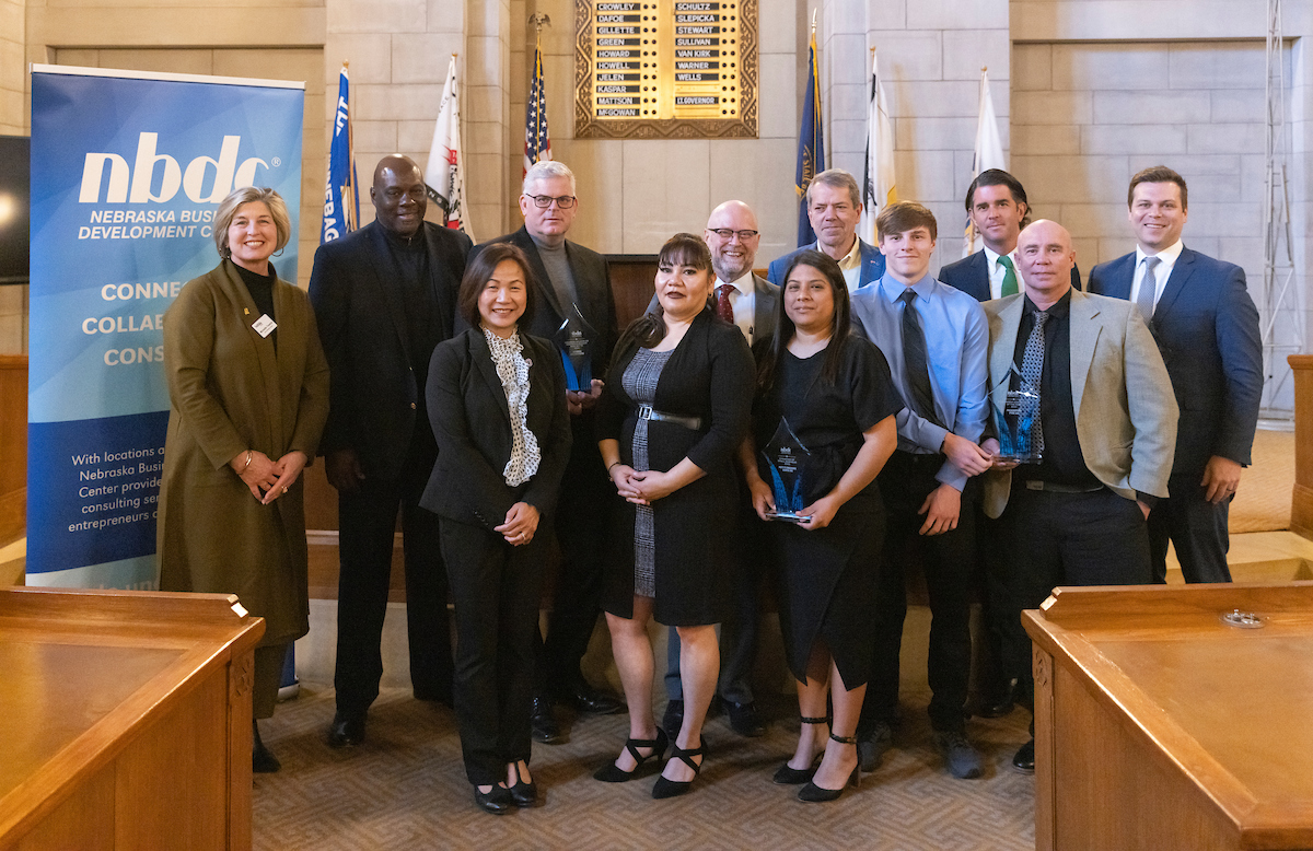 2023 NBDC Award Winner Photos with Governor Jim Pillen, NBDC Executive Director Dan Curran, Nebraska Economic Development Director K.C. Belitz, UNO Chancellor Jo Li, and UNO CBA Dean Michelle Trawick