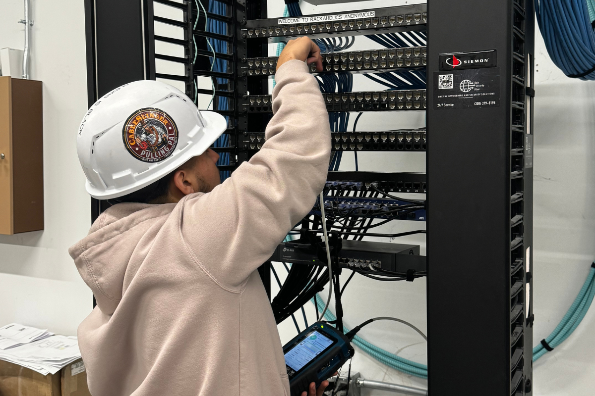 Oneway Networking & Security Solutions staff member working on a piece of computer hardware