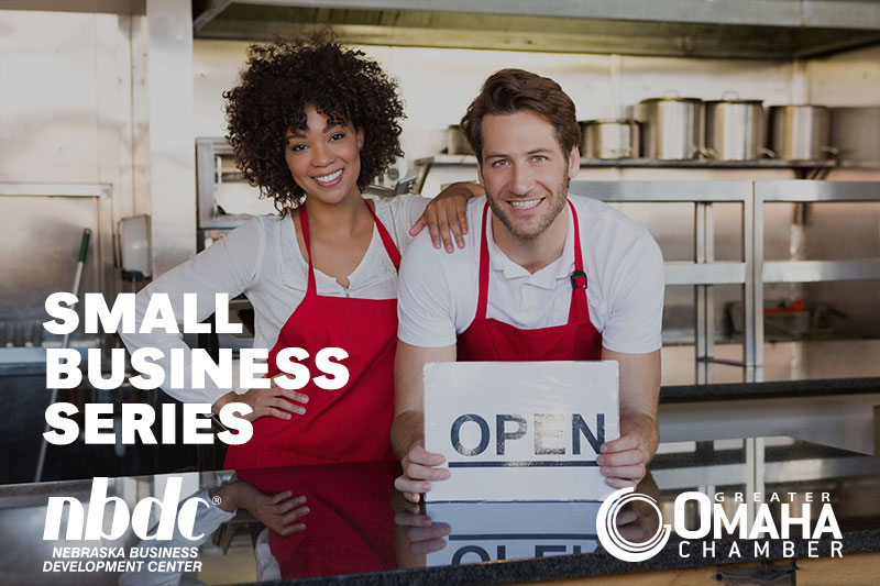 woman and man posing in cafe with an open sign