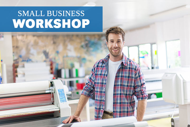 male worker smiling in print shop 