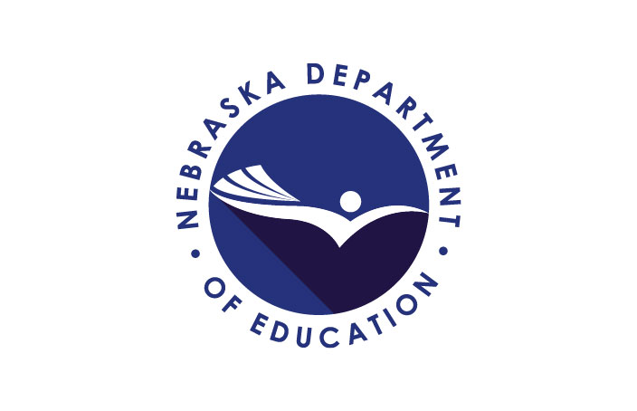 Logo of the Nebraska Department of Education. The circular design features a stylized open book forming the shape of a person with arms raised, set against a deep blue background. The words “Nebraska Department of Education” encircle the logo in uppercase letters.