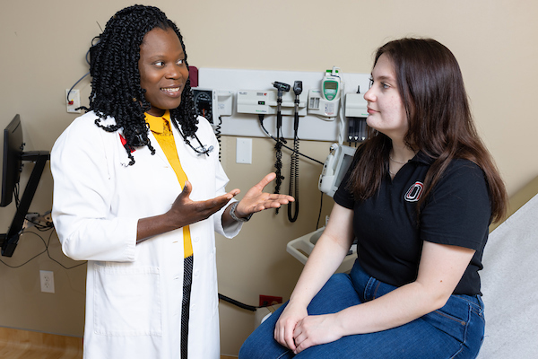 doctor speaking to student patient