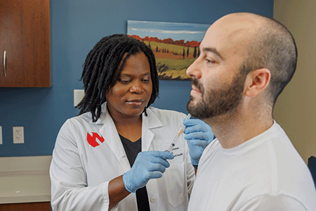 a doctor checks a patient's health.