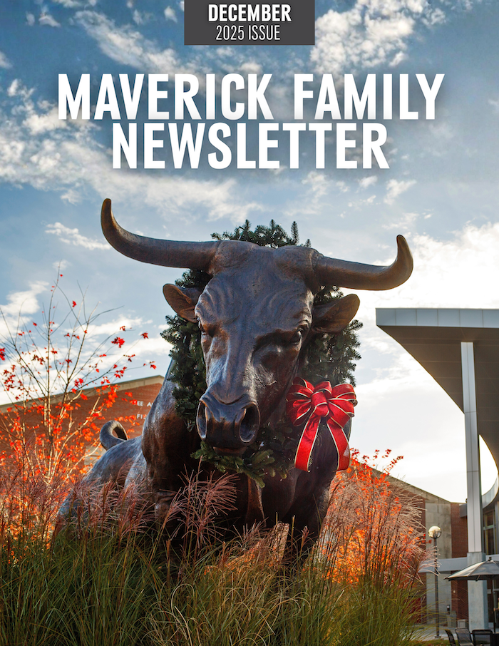 UNO's bull statue with a holiday wreath on it.