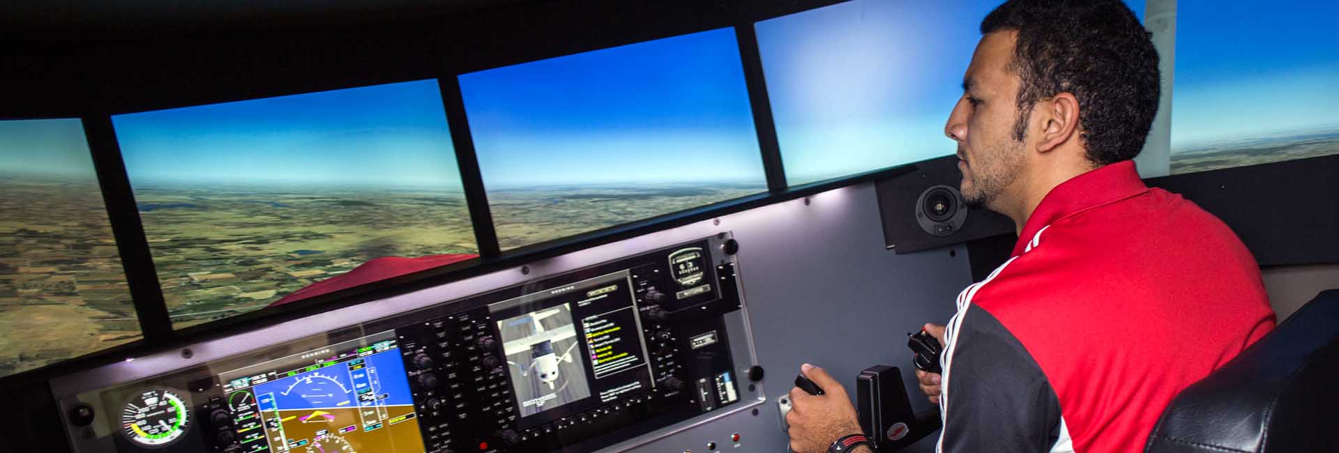 UNO student flies Aviation Institute's flight simulator