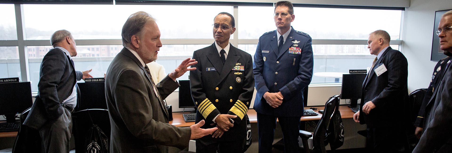 CBA Dean Louis Pol speaking with Admiral Cecil D. Haney