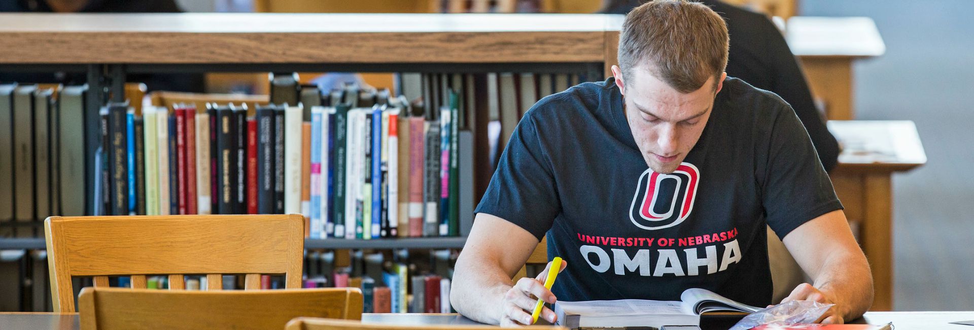 student in library