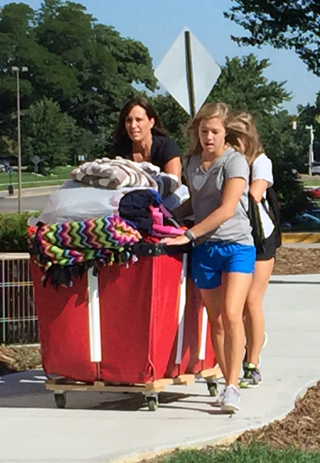 A student moves into University Village. 