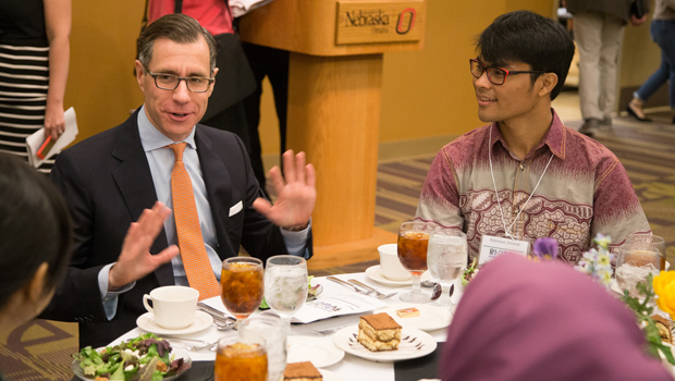 Gregory Feifer chats with conference attendees before his speech.