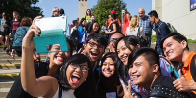 YSEALI students pose for a group selfie in front of the Milo Bail Student Center