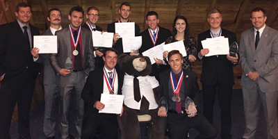 The Flying Mavs pose with their awards and unofficial mascot after the competition's awards banquet.