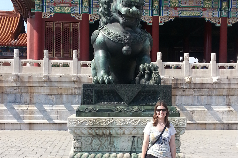 Sarah Gaughan stands in front of the Forbidden City in Beijing. Gaughan has traveled to China to study Asian carp.