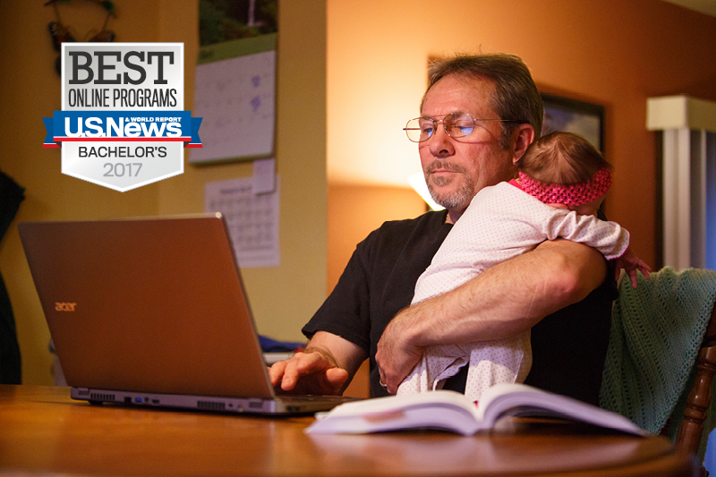UNO student Michael Beland studies with his daughter