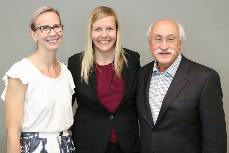 UNO doctoral student Jordan Wickstrom (center) poses with her mentor Jenna Yentes, assistant professor of Biomechanics at UNO, and Samuel Meisels, Buffett Institute executive director.
