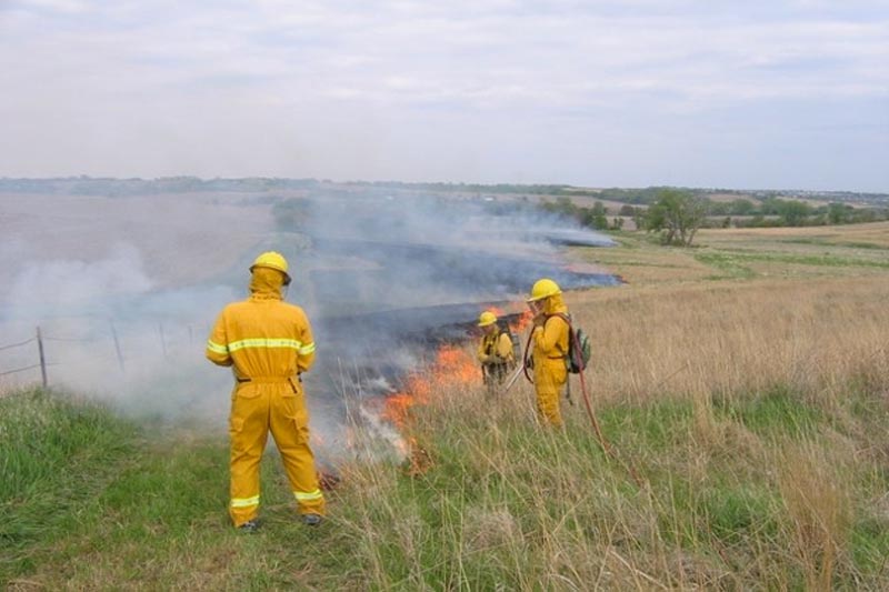 A controlled burn takes place at the Glacier Creek Preserve