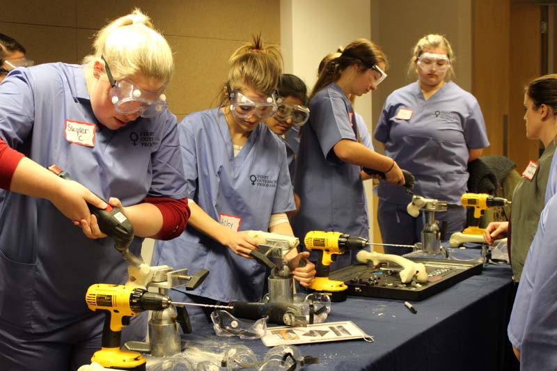 High school students participate in mock orthopaedic surgeries when the Perry Initiative event was first held on UNO's campus in 2017.