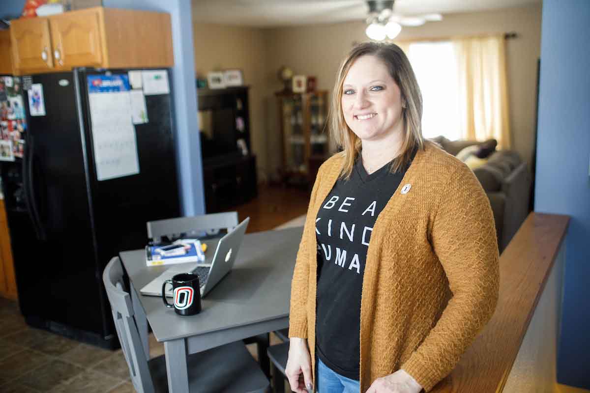 Gina Clyde poses for a photo at her office