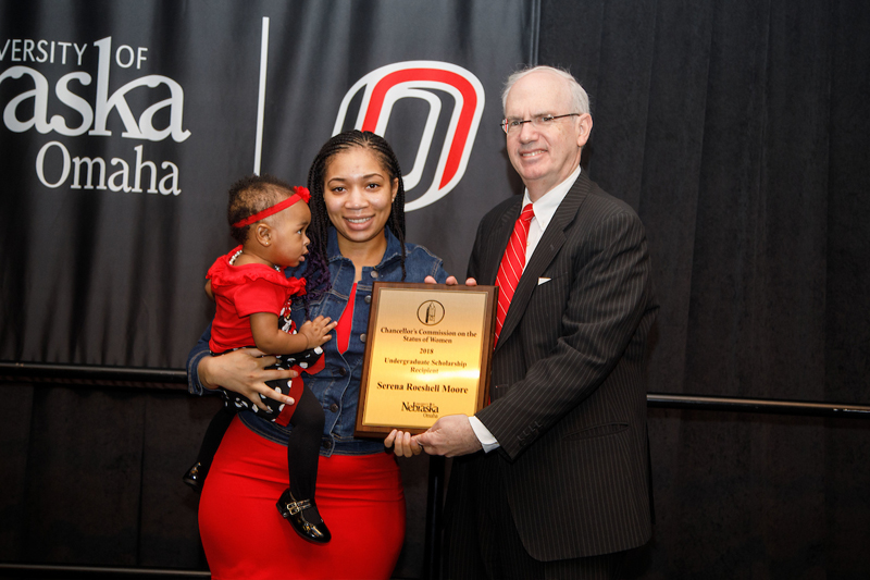 Moore brought her daughter Layla with her to accept the award. An event emcee shared how Moore finished her semester with a 3.8 GPA just two months after she gave birth to her daughter.