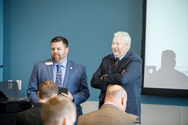 LEAD program participant Dustin Smith of Plattsmouth, Nebraska (left) and UNO Senior Vice Chancellor for Academic Affairs B.J. Reed (right) talk about UNO's impact at the Barbara Weitz Community Engagement Center.