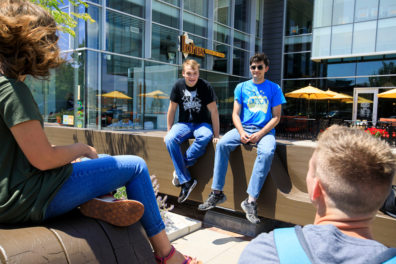 Students in the Entrepreneurial Living Learning Community (ELLC), a learning community of the Center for Innovation, Entrepreneurship & Franchising (CIEF), chat in Aksarben Village.