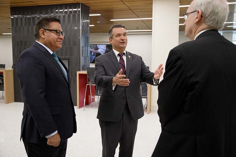 Reps. Don Bacon and Salud Carbajal speak with UNO Chancellor Jeffrey P. Gold