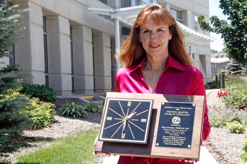 Ellen Freeman-Wakefield stands in front of the CPACS building on UNO's campus